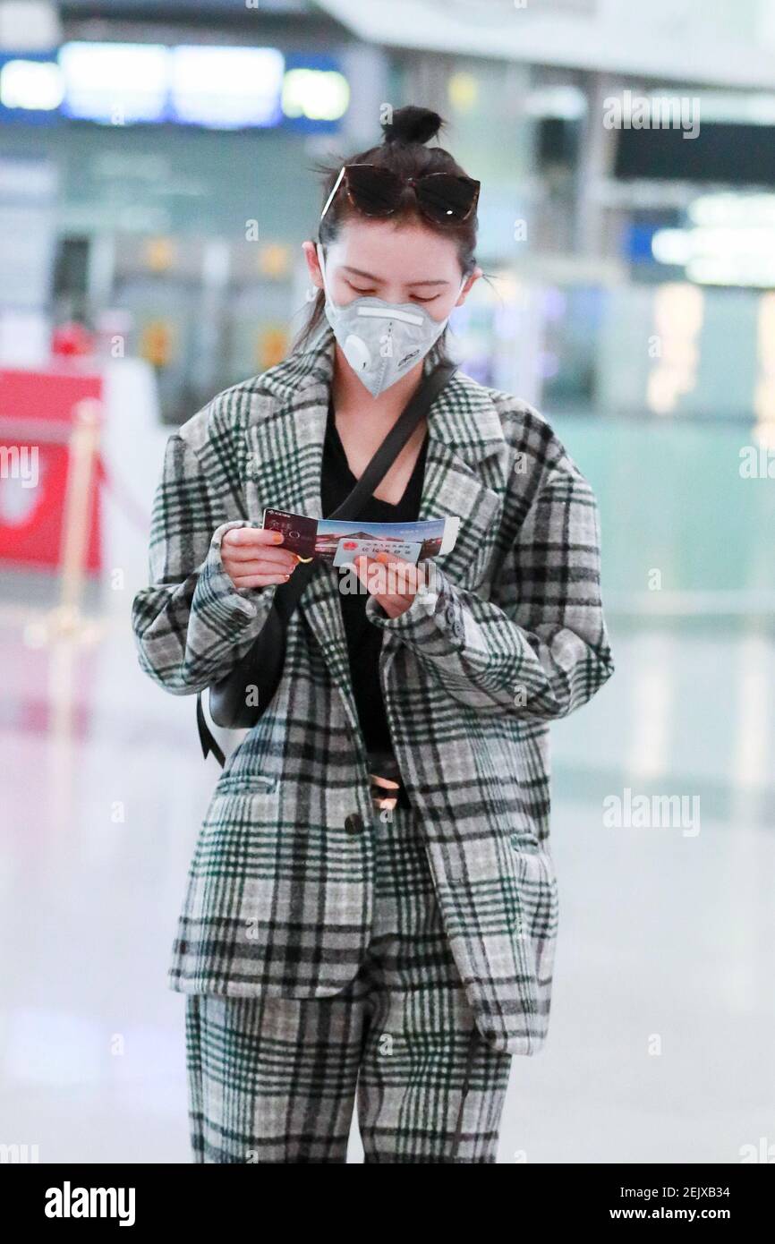 Chinese actress Zhang Yuxi arrives at a Beijing airport before ...