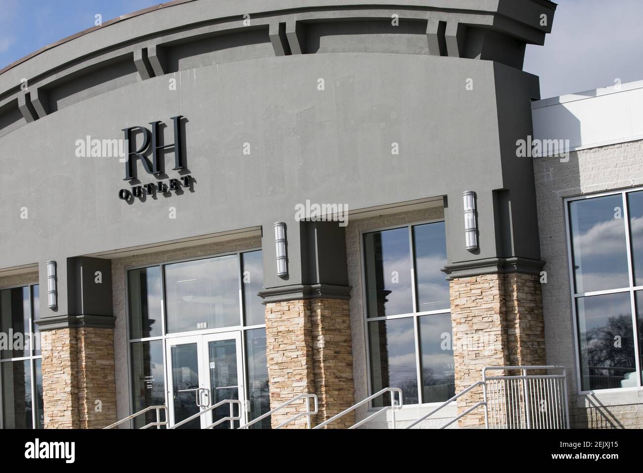 A logo sign outside of a Restoration Hardware (RH) Outlet retail store