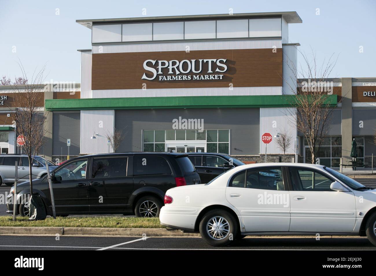 A logo sign outside of a Sprouts Farmers Market retail grocery store