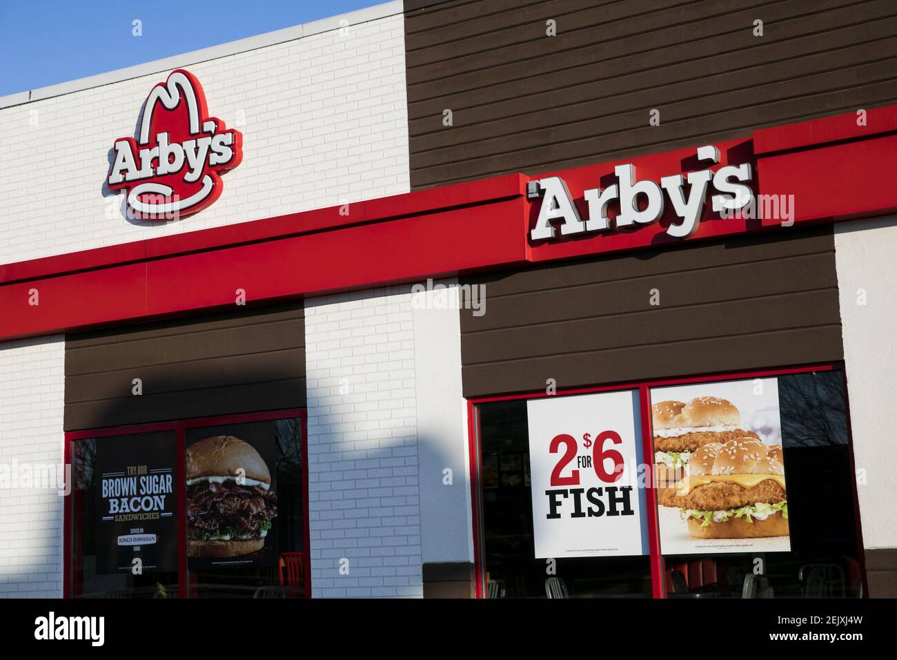 A logo sign outside of a Arby's restaurant location in Bel Air ...