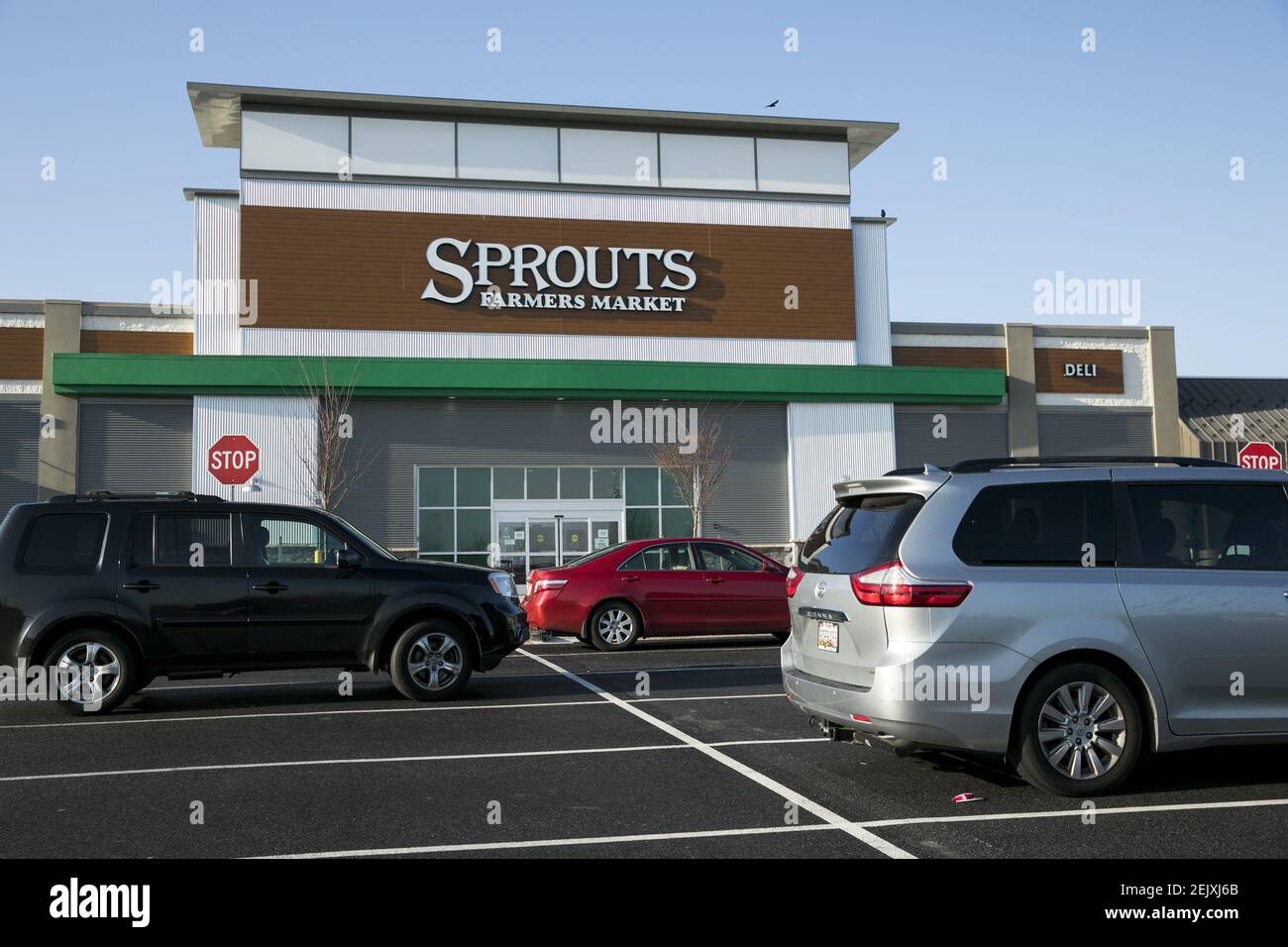 A logo sign outside of a Sprouts Farmers Market retail grocery store