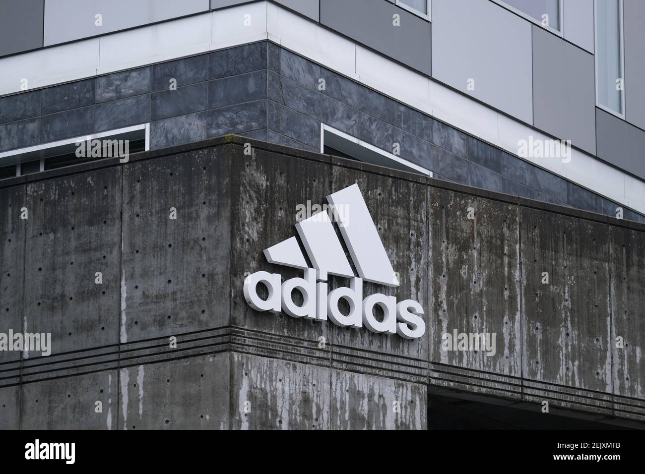 A logo is pictured on the Adidas North American Headquarters in Portland,  Ore., on March 14, 2020. The German shoe company closed all stores in North  America and Europe in response to