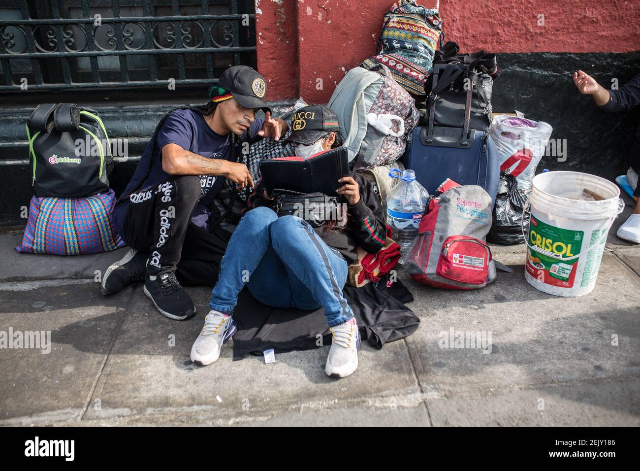 A young couple wait at the entrance of the bullring. The Acho bullfighting  ring in Lima has been settled to accommodate homeless and vulnerable people  during the Covid-19 quarantine. During morning hour's