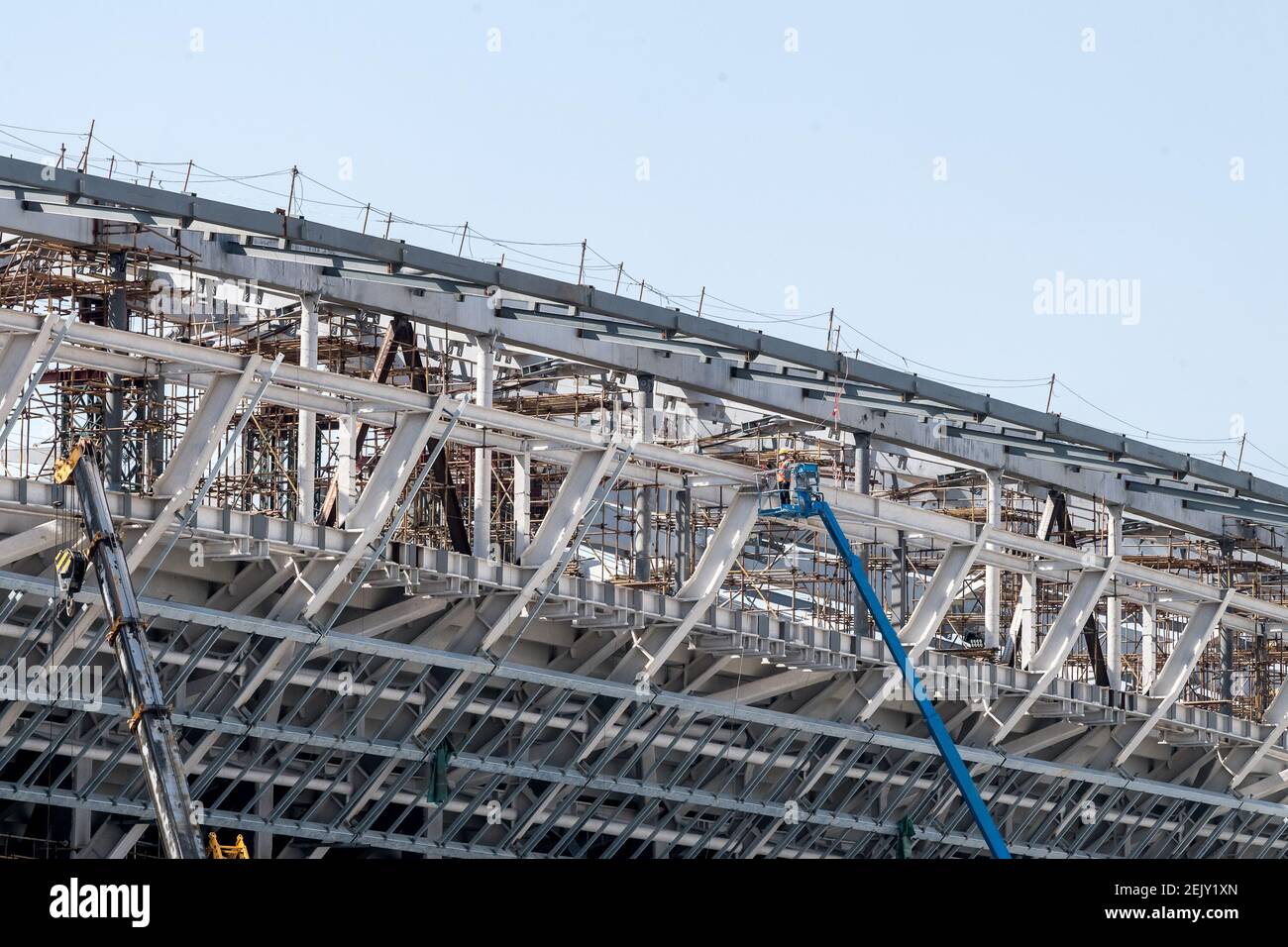 Workers are busy at constructing the Pudong Football Stadium, which