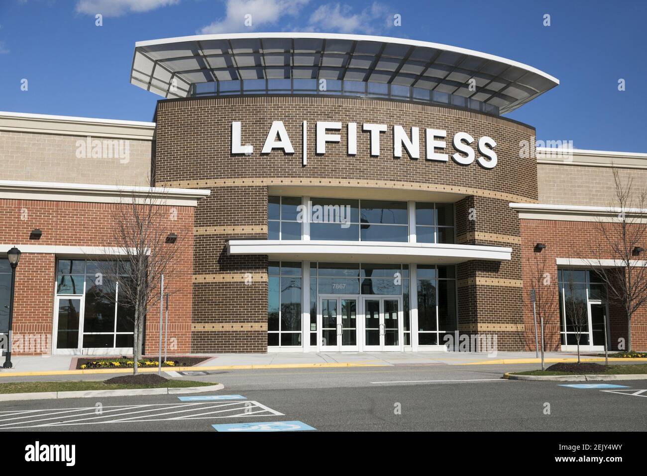 A logo sign outside of a LA Fitness location in Alexandria, Virginia on
