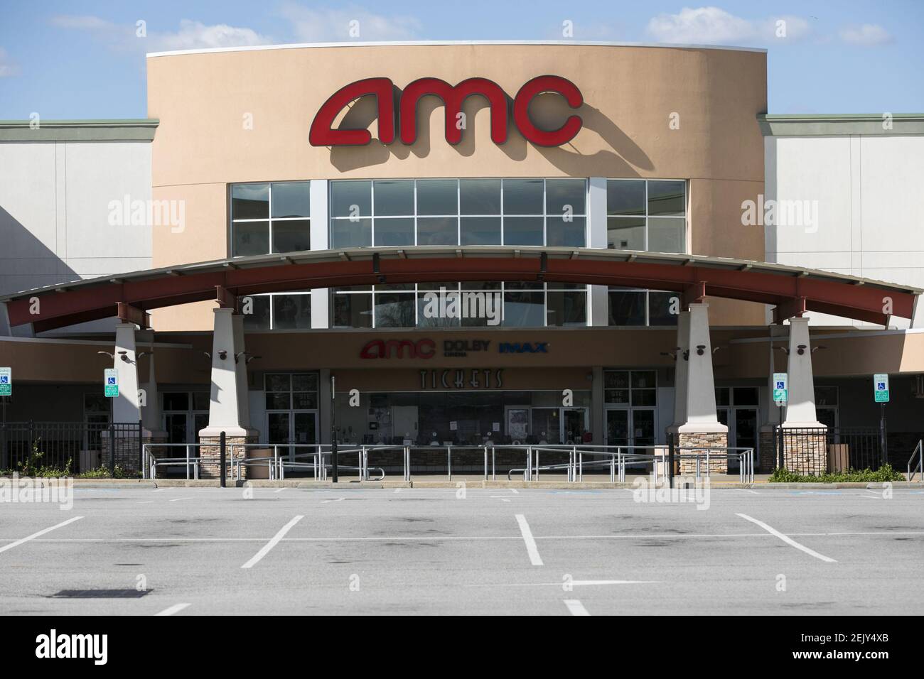 A logo sign outside of a AMC Theatres location in Woodbridge, Virginia