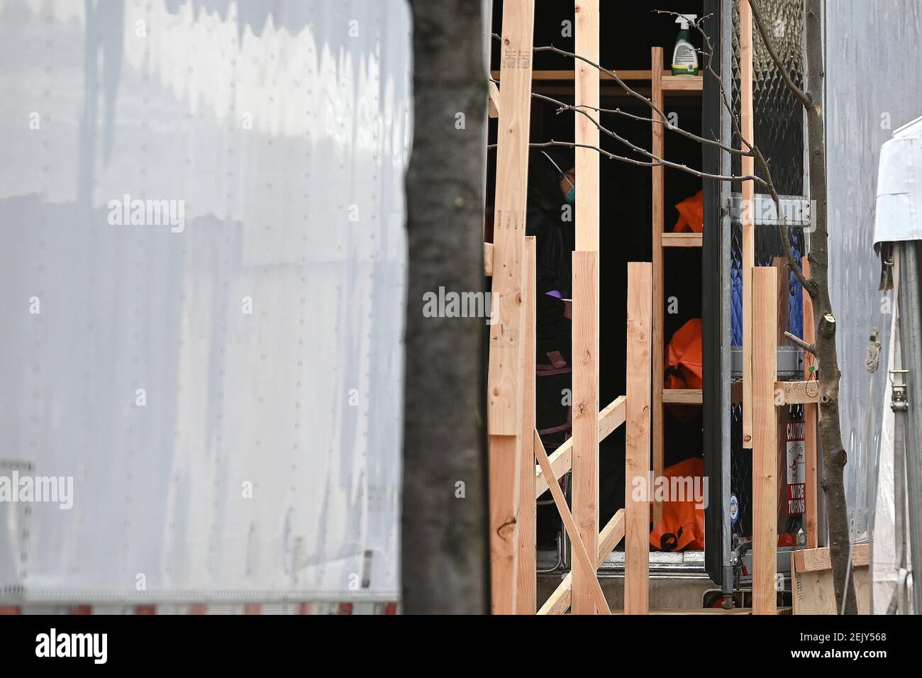 Bodies of a deceased patient are stacked inside a refrigerated overflow