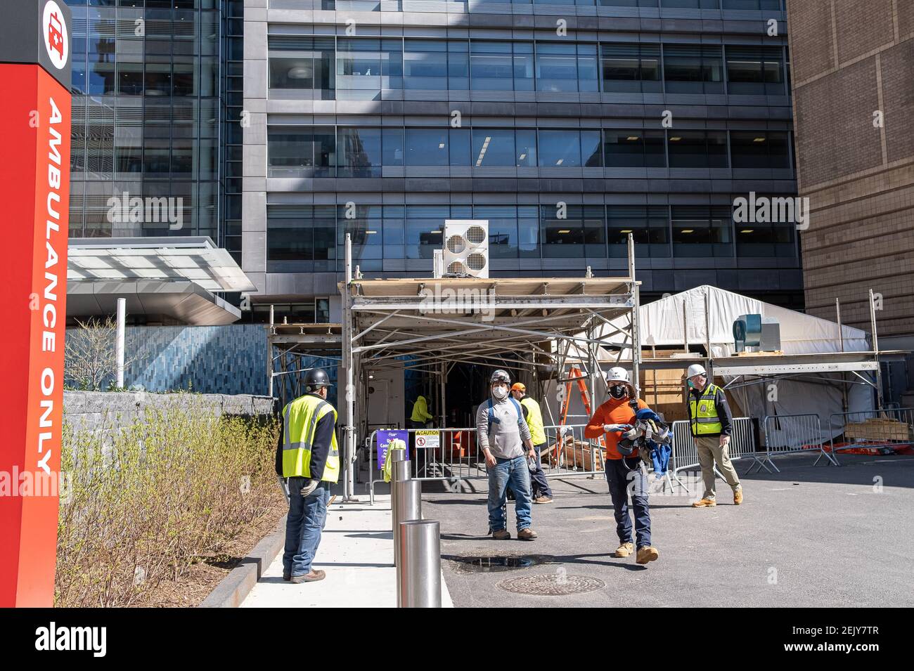 Amid an an anticipated apex in COVID19 deaths, construction workers build a refrigerated