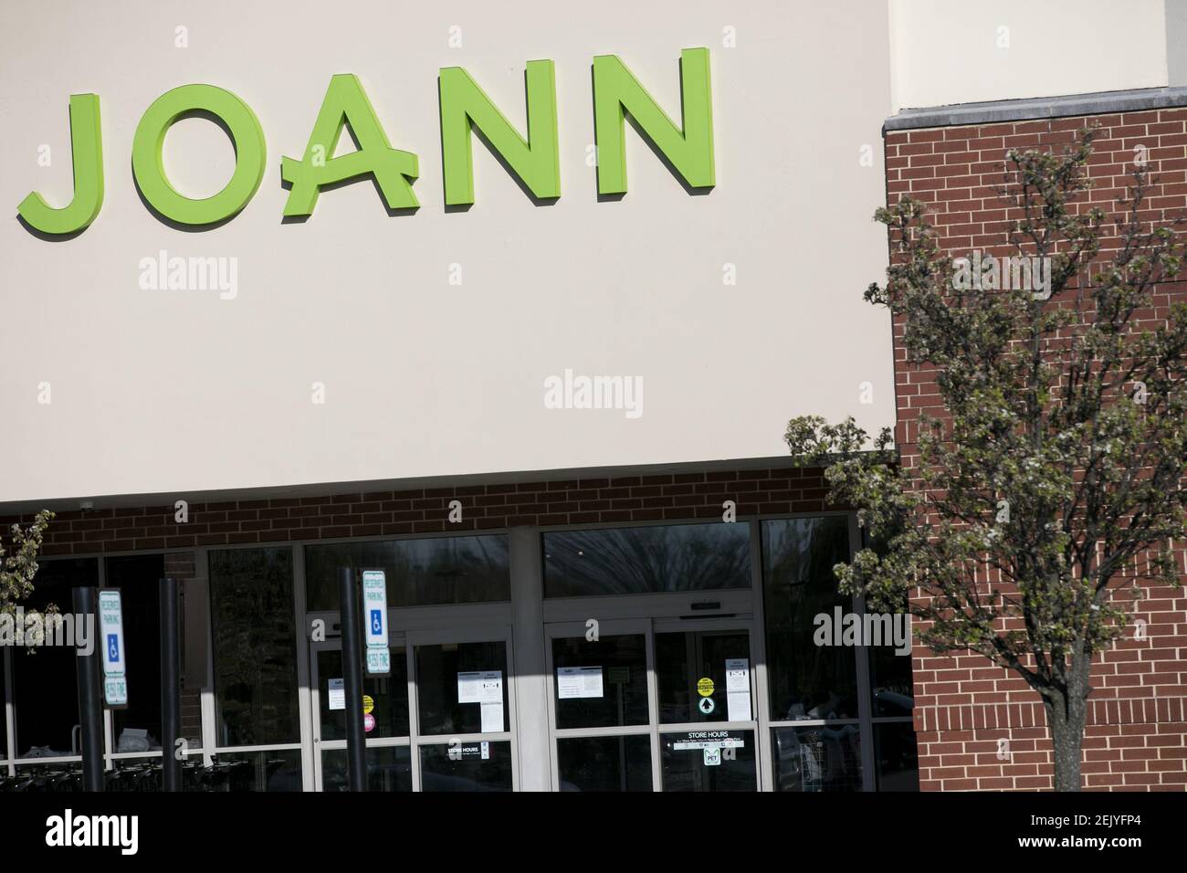 A logo sign outside of a JOANN Fabrics and Crafts retail store location