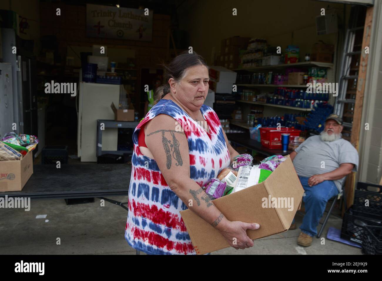 Volunteers at Pantry 279 distribute food to area residents experiencing