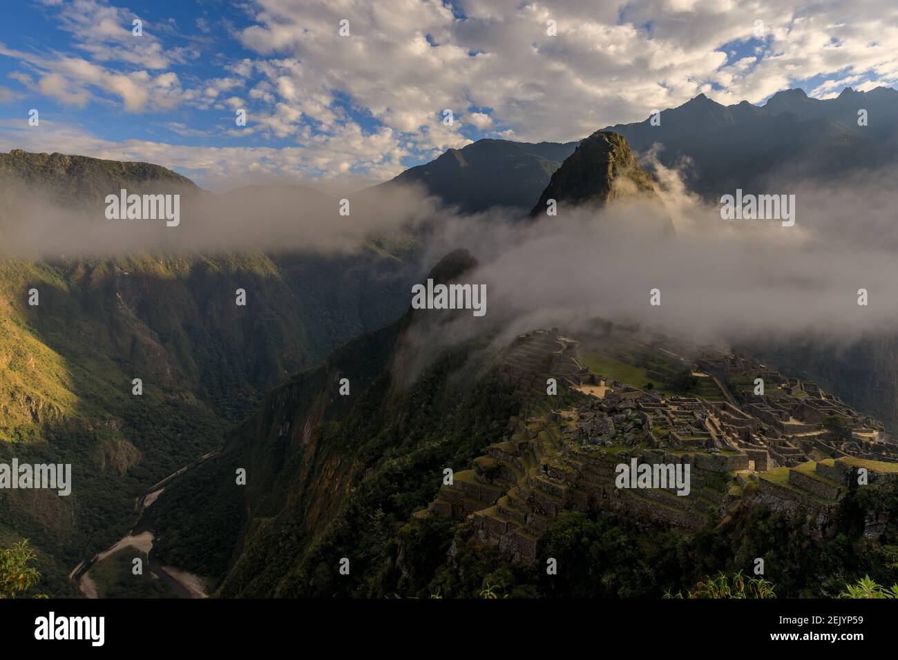 The old Inca city temple of Machu Picchu surrounded by a cloud Stock ...