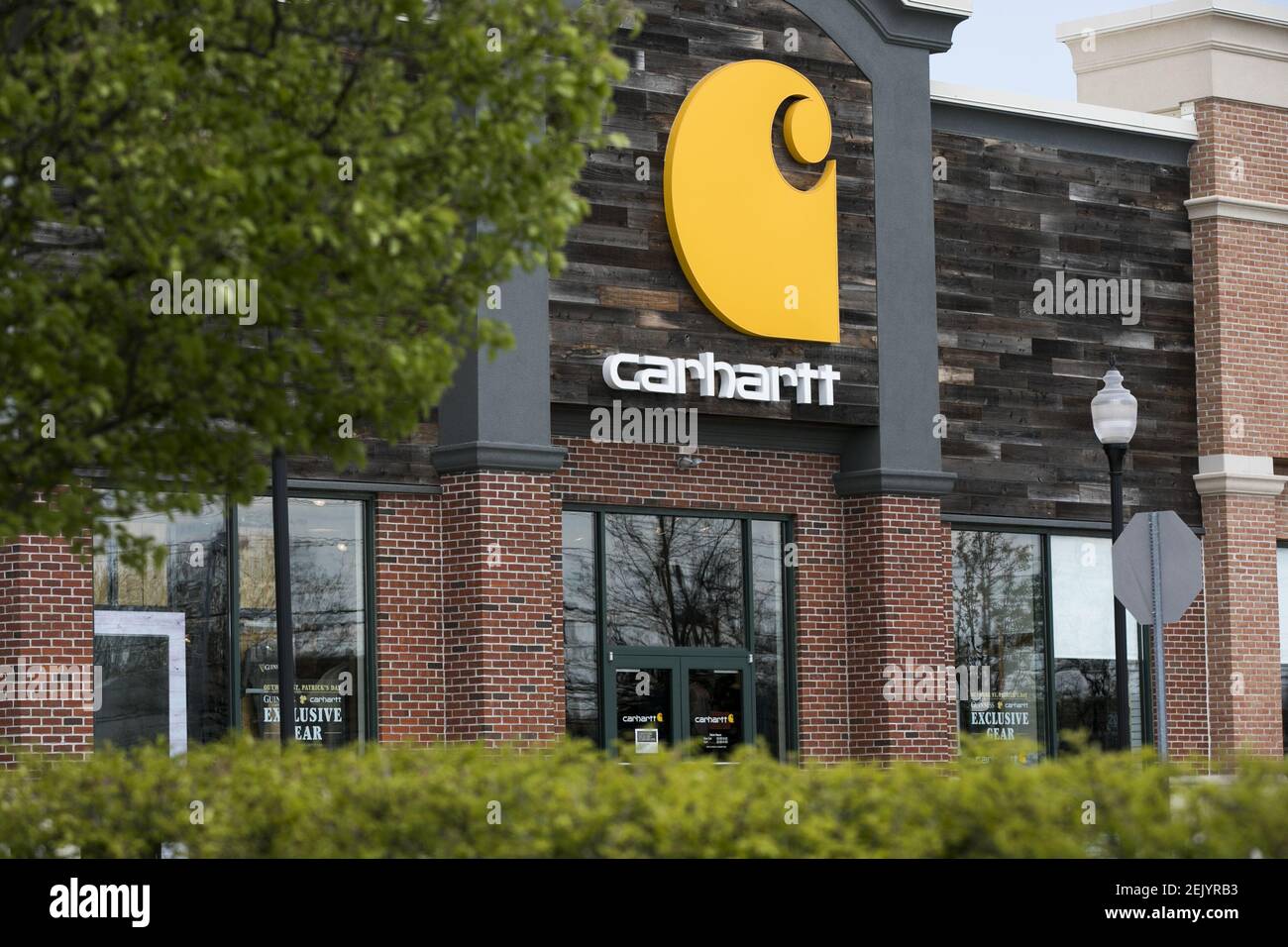 A logo sign outside of a Carhartt retail store location in Cherry