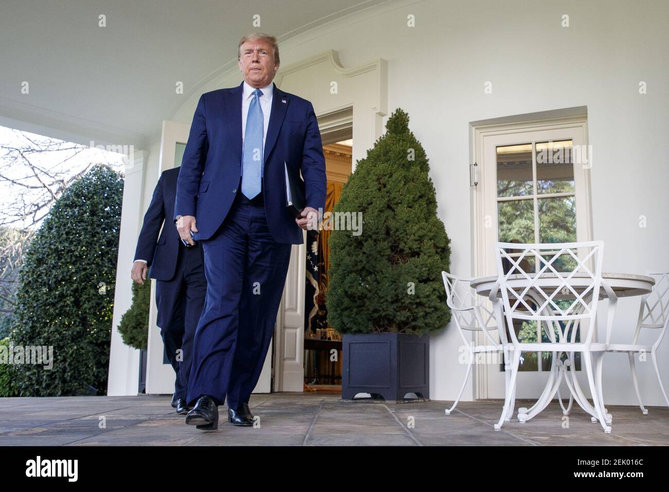 US President Donald J. Trump walks out of the Oval Office to the ...