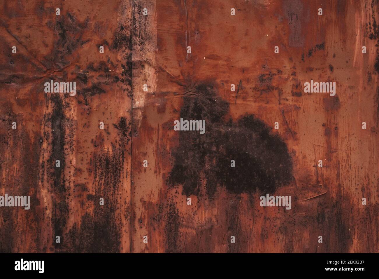 Multicolored backgroundrusty metal surface with peeling and cracking