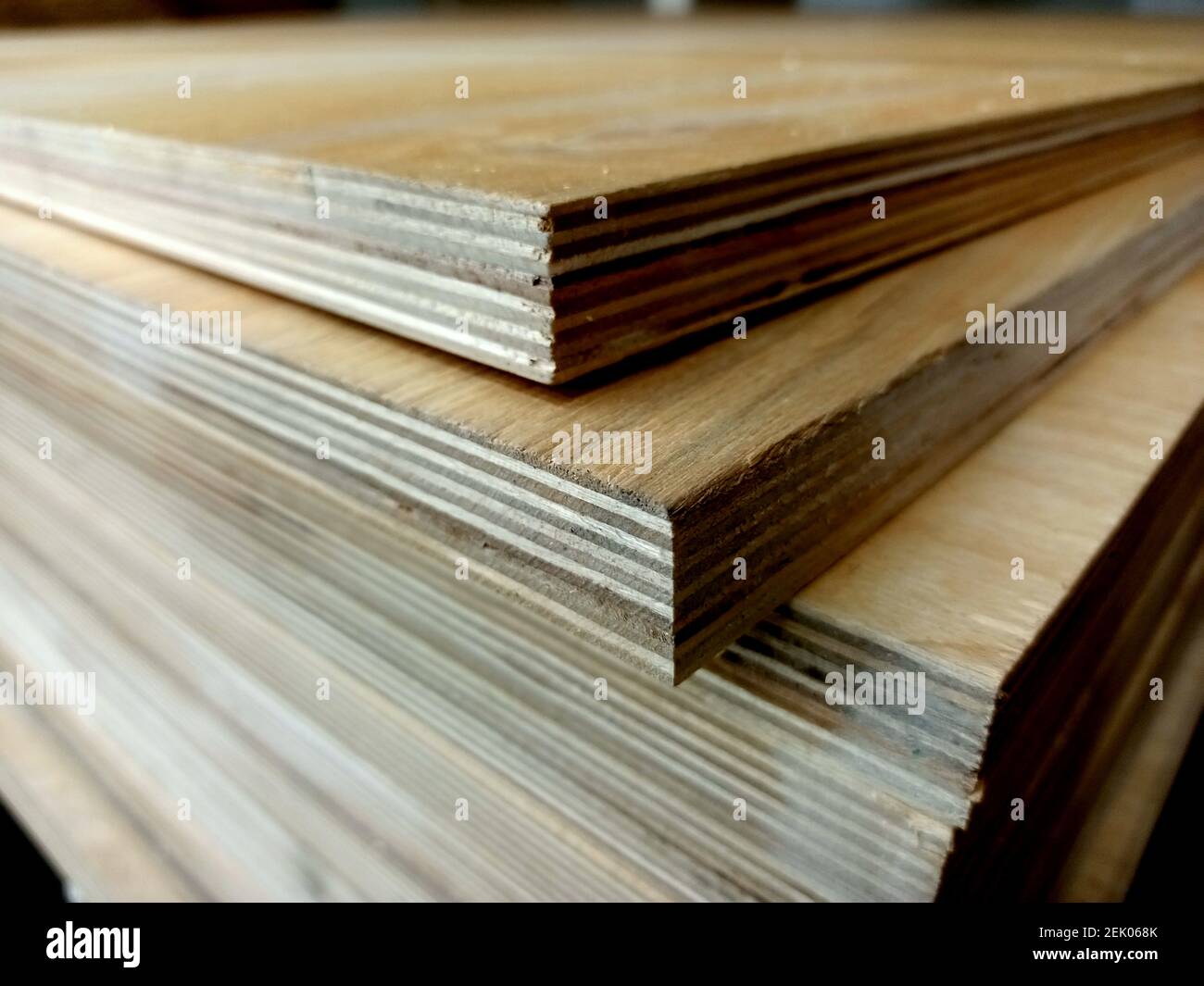 A stack of plywood sheets for construction. A pile of wooden chipboard