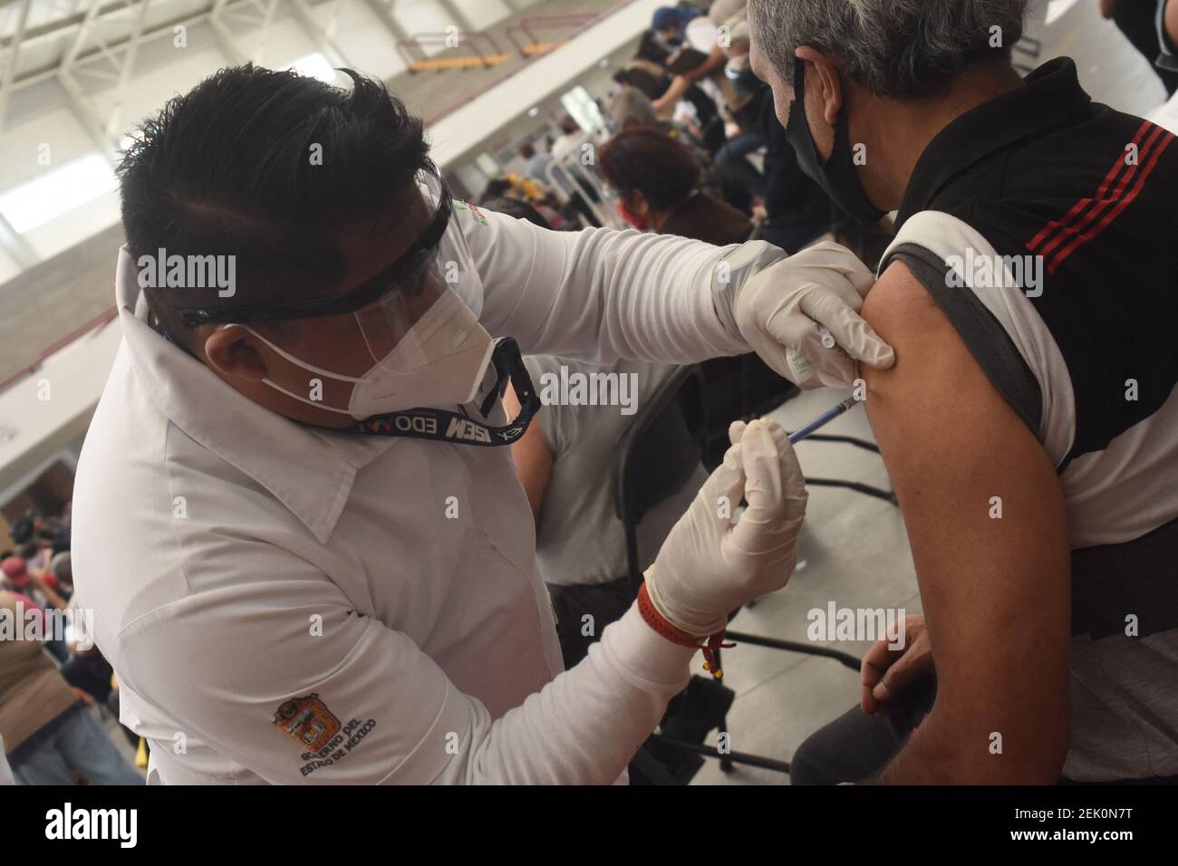 A Health worker administers Sinovac vaccine to a persons against coronavirus disease (COVID-19), during a mass vaccination to elderly persons at Las Americas Sport Center on February 22, 2021 in Ecatepec, State of Mexico, Mexico. Photo by Jose M. Ruiz/Eyepix/ABACAPRESS.COM Stock Photo