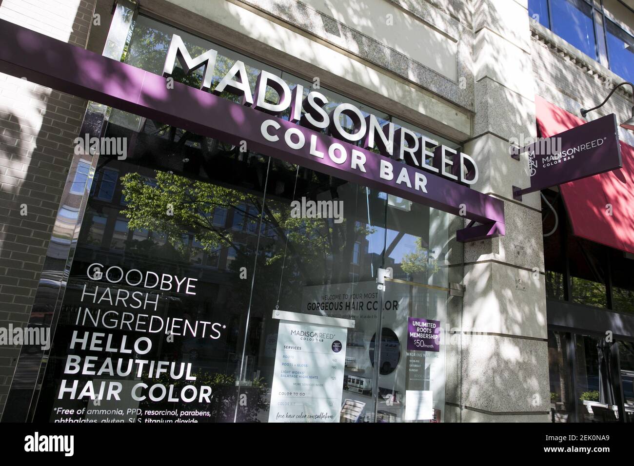 A logo sign outside of a Madison Reed Color Bar store location in ...