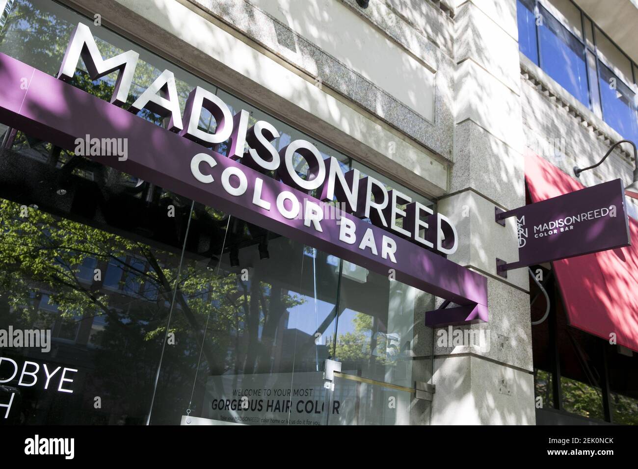 A logo sign outside of a Madison Reed Color Bar store location in ...