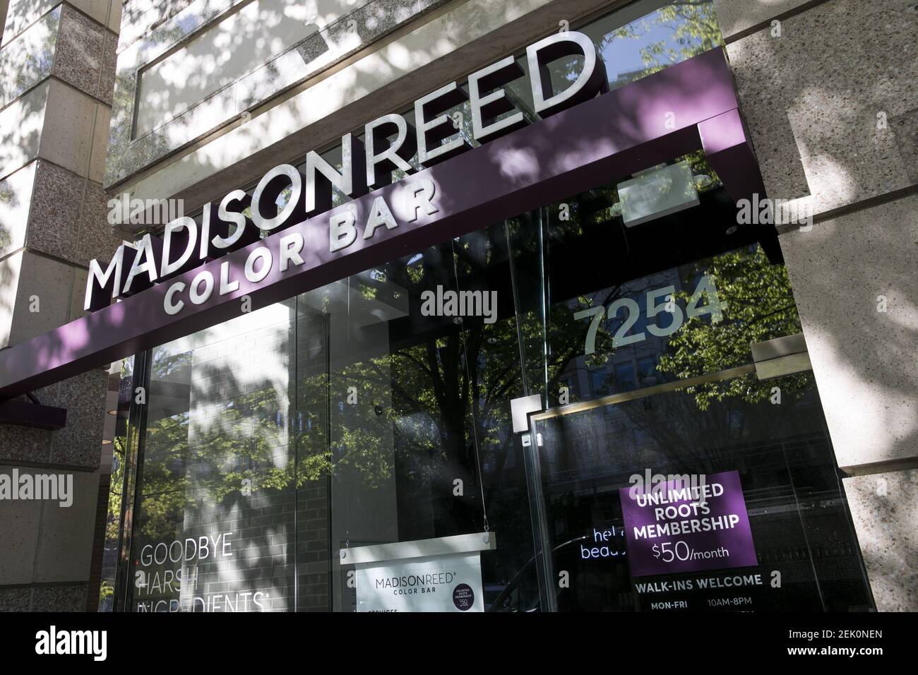 A logo sign outside of a Madison Reed Color Bar store location in ...