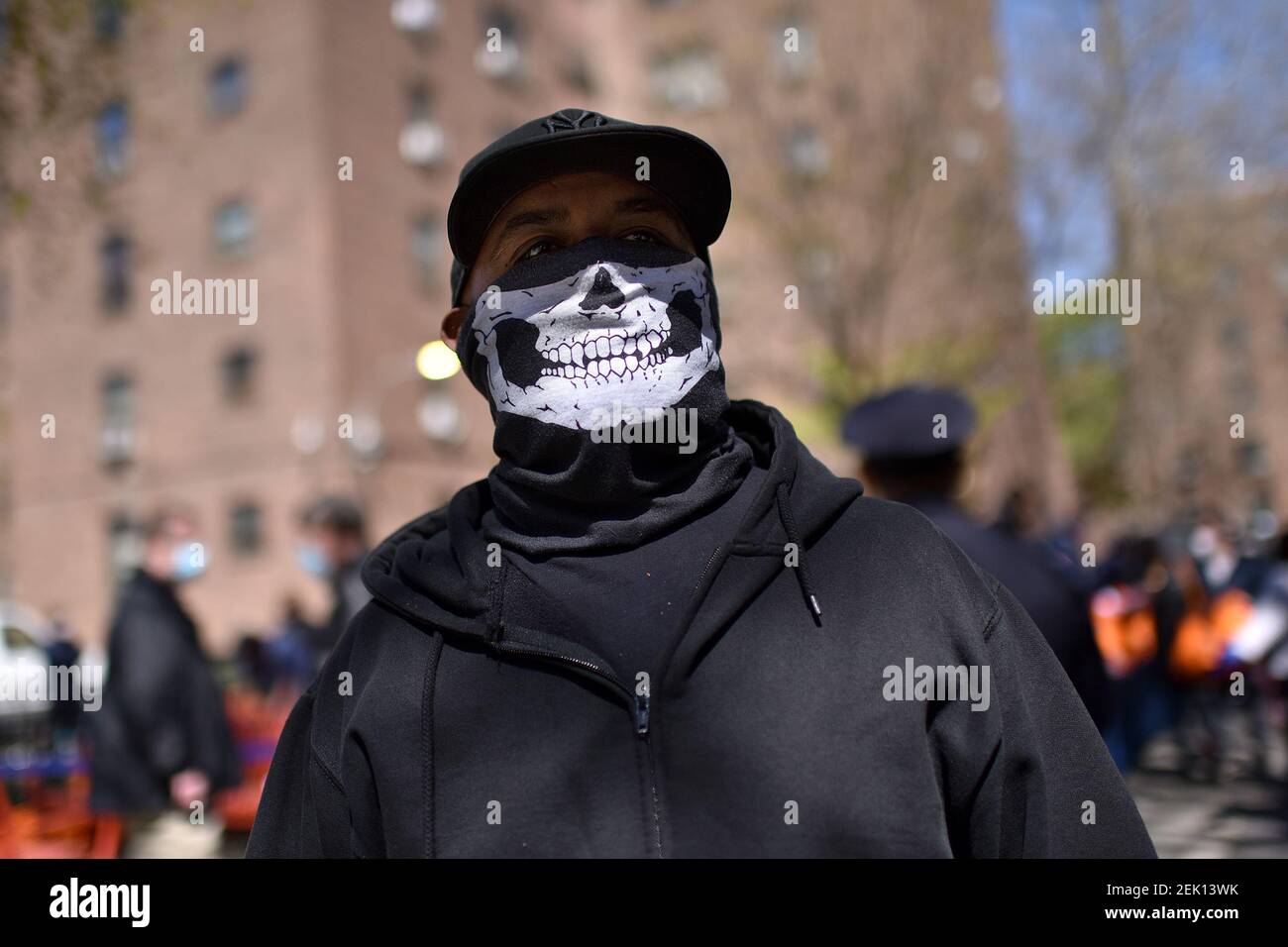A man wearing a “skeleton face” mask poses after receiving a personal  protection equipment (protective face masks and gloves) distributed by New  York City Mayor Bill de Blasio at Marcy Houses in