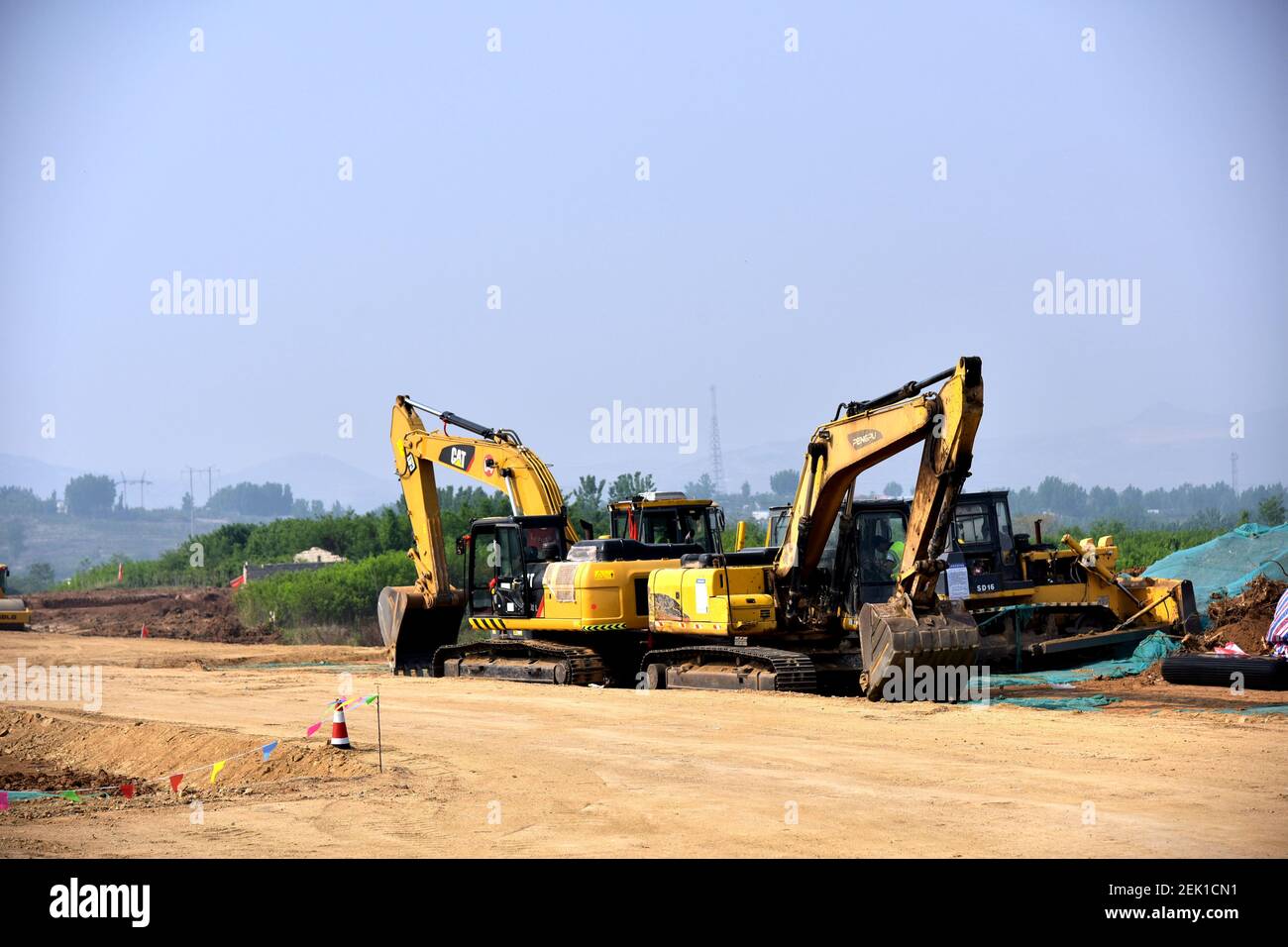 With help of excavators, construction workers build the highspeed