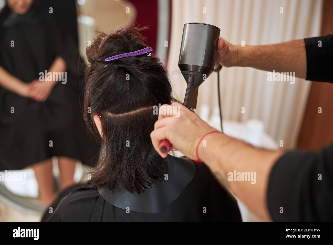 Close up woman using hair dryer hi-res stock photography and images - Alamy
