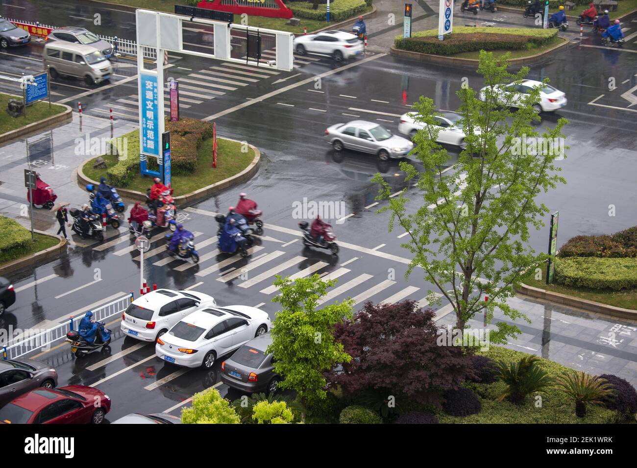 HAI'AN, CHINA - MAY 8, 2020 - Pedestrians cross a zebra crossing in the