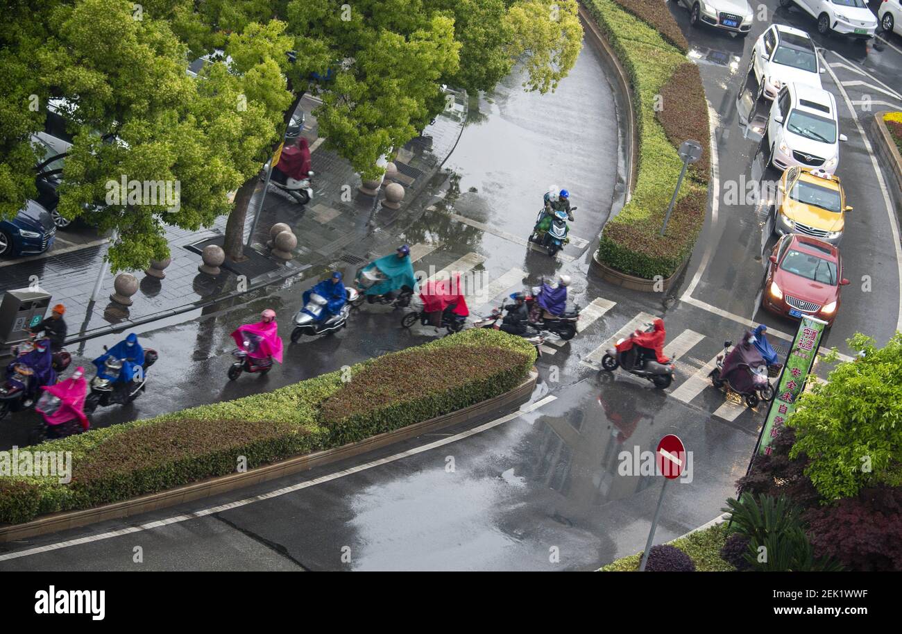 HAI'AN, CHINA - MAY 8, 2020 - Pedestrians cross a zebra crossing in the