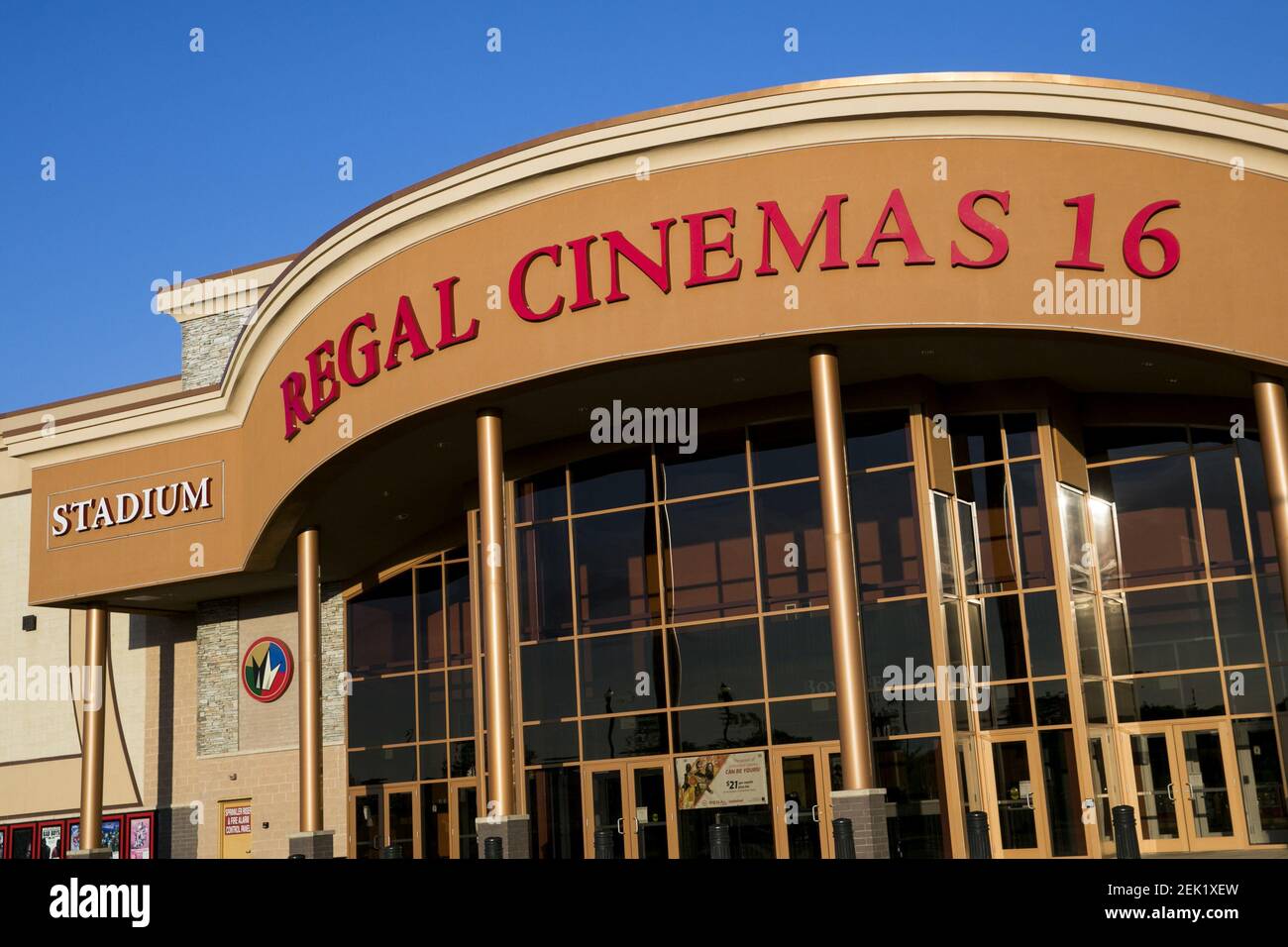 A logo sign outside of a Regal Cinemas movie theater location in
