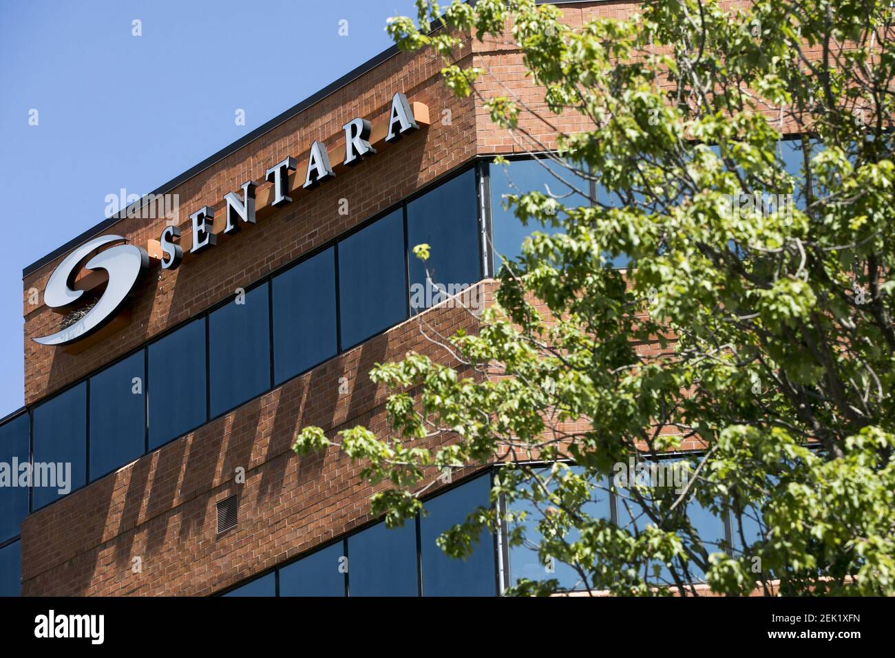 A logo sign outside of a facility occupied by Sentara Healthcare in ...