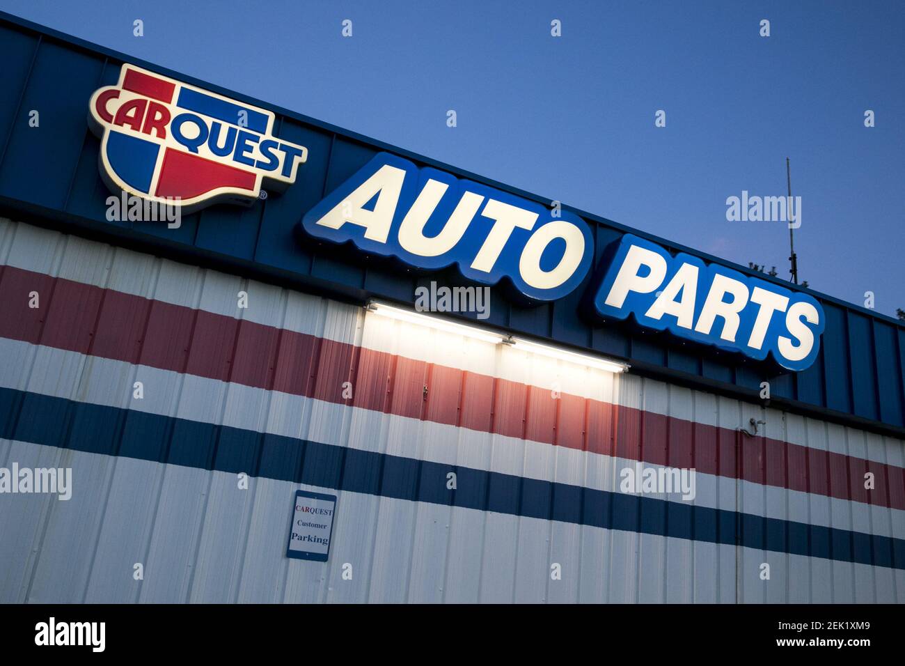 A logo sign outside of a Carquest Auto Parts retail store location in