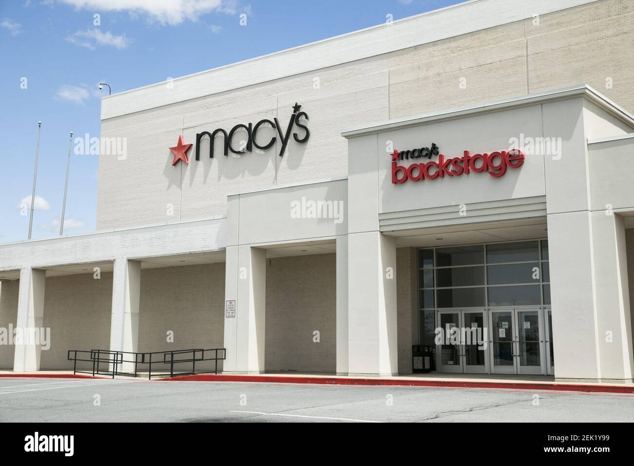 Logo signs outside of a Macy's and Macy's Backstage retail store