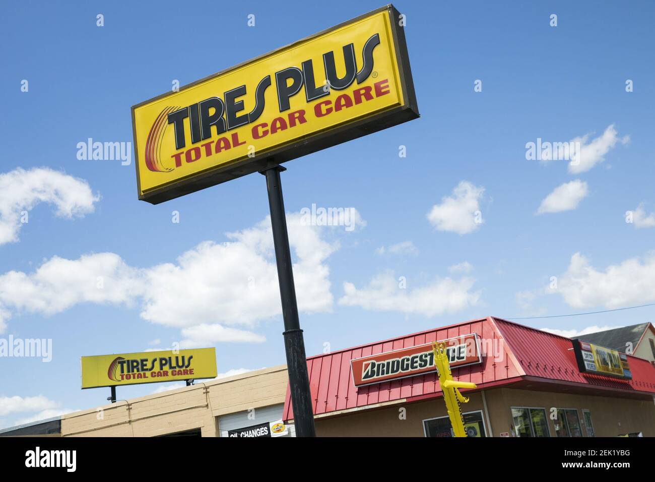 A logo sign outside of a Tires Plus retail store location in Harrisburg