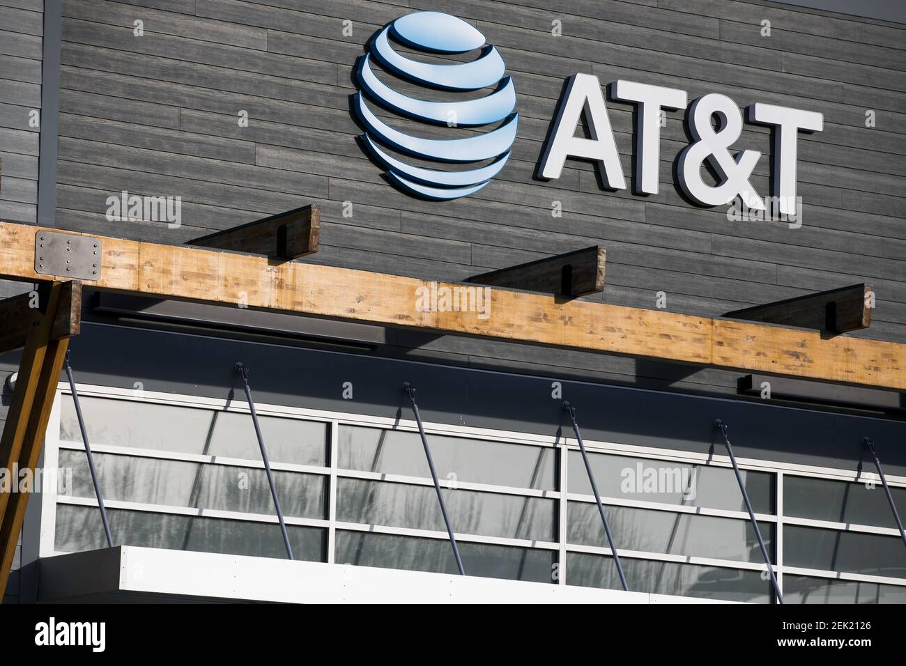 A logo sign outside of a AT&T retail store location in Wilmington ...