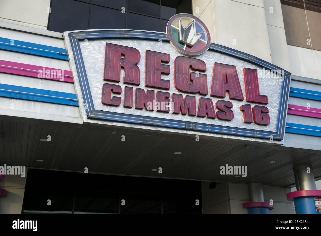 A logo sign outside of a Regal Cinemas movie theater location in