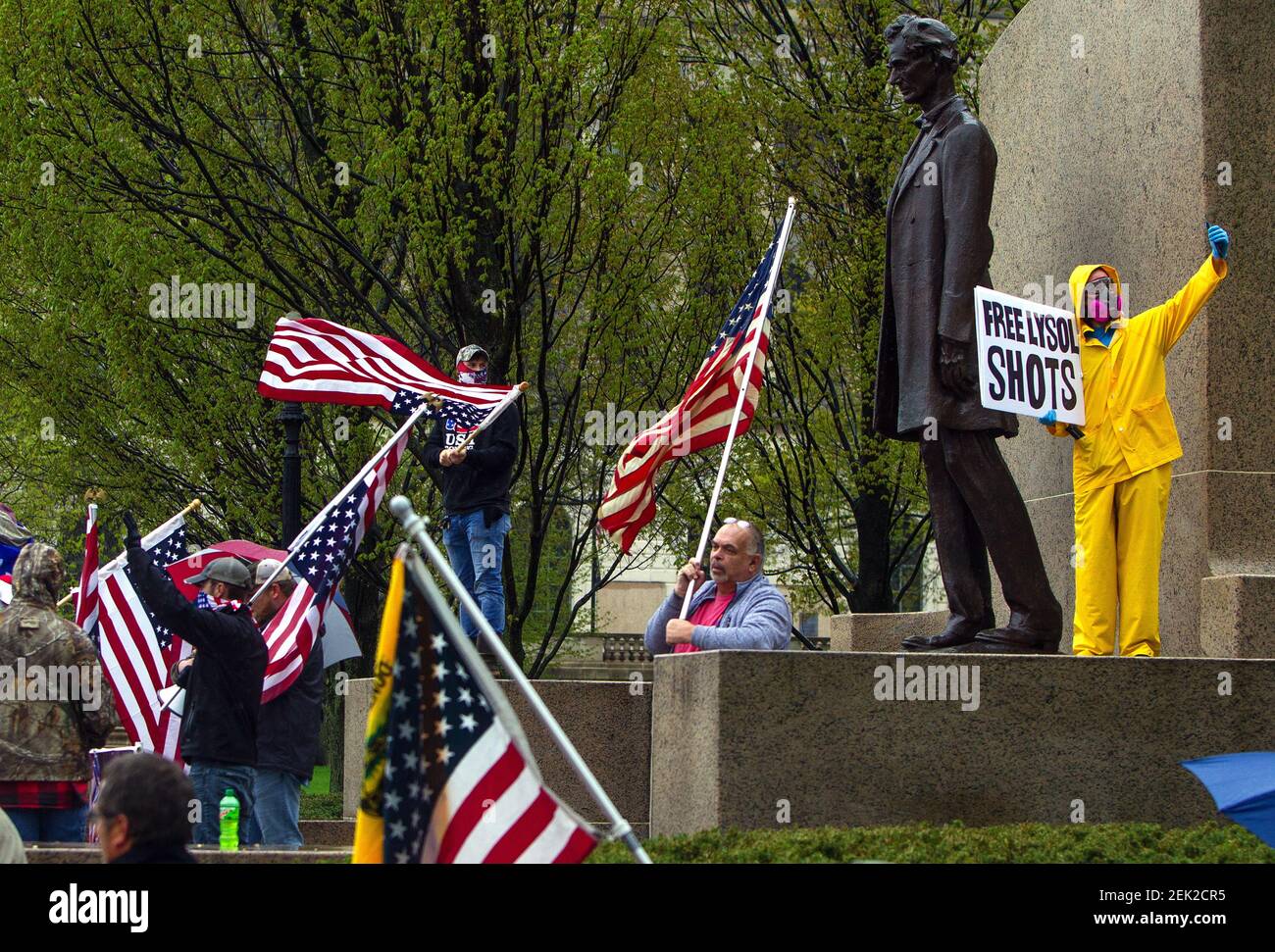 Apr 25, 2020; Springfield, IL, USA; John Keating (R) takes a selfie while counter-protesting a protest against the state's stay-at-home order in front of the Illinois Capitol building Saturday, April 25, 2020. Keating's sign is a reference to President Donald Trump's recent suggestion that Americans should inject themselves with household disinfectants as a coronavirus remedy. Mandatory Credit:Ted Schurter/The State Journal-Registervia USA TODAY NETWORK/Sipa USA Stock Photo