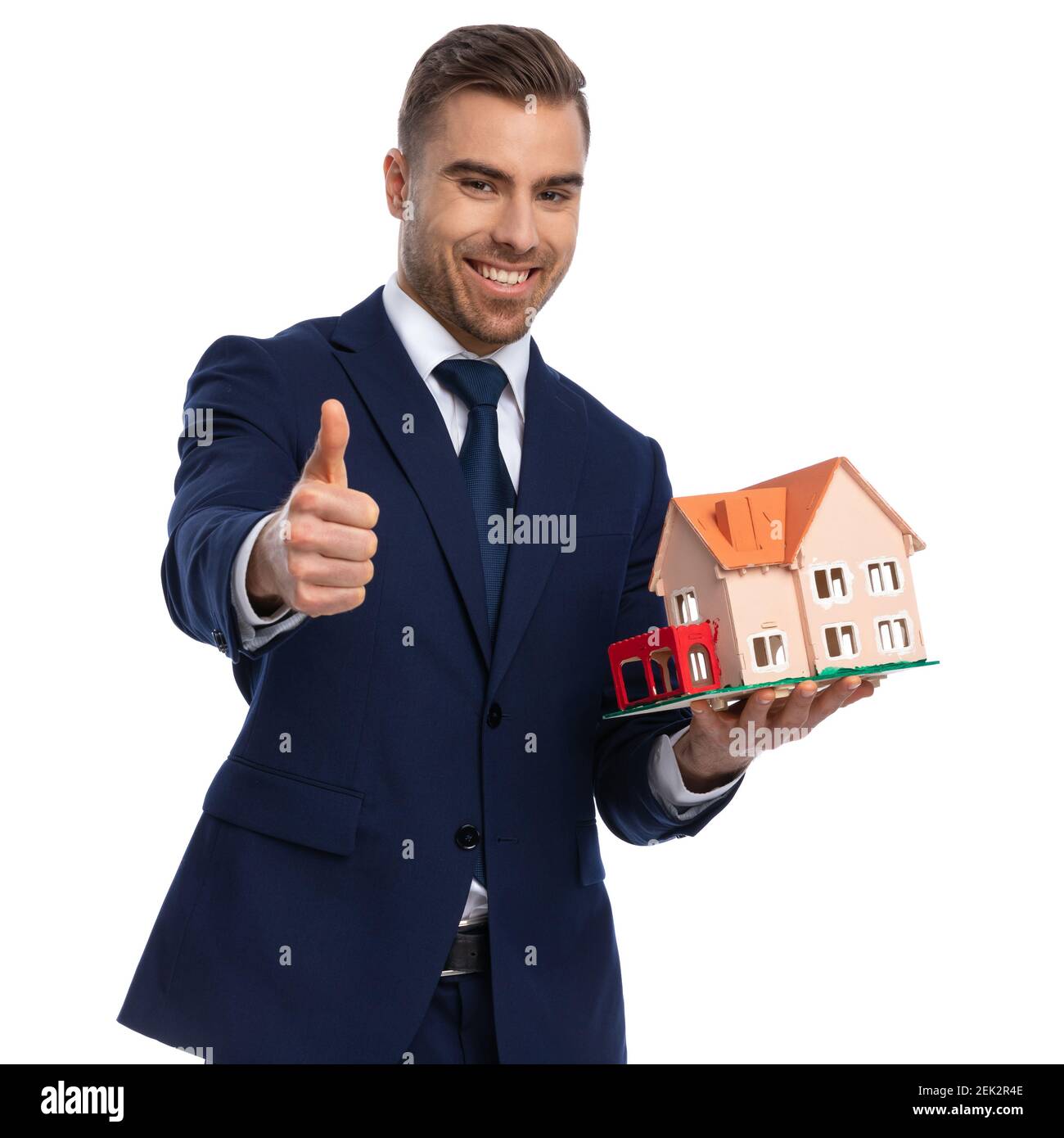 confident real estate agent in navy blue suit posing isolated on white ...