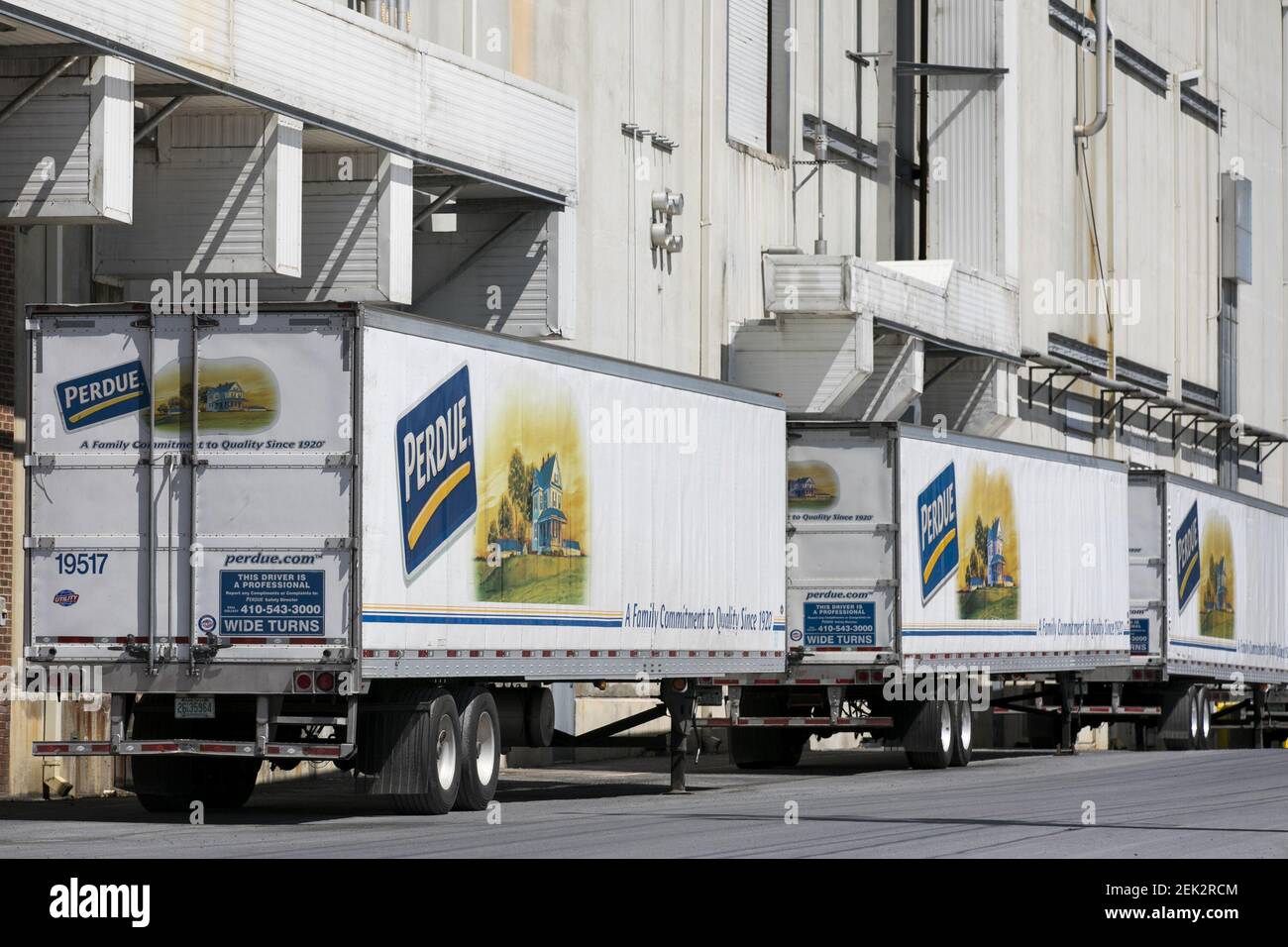 A logo sign outside of a Perdue Farms poultry processing plant in