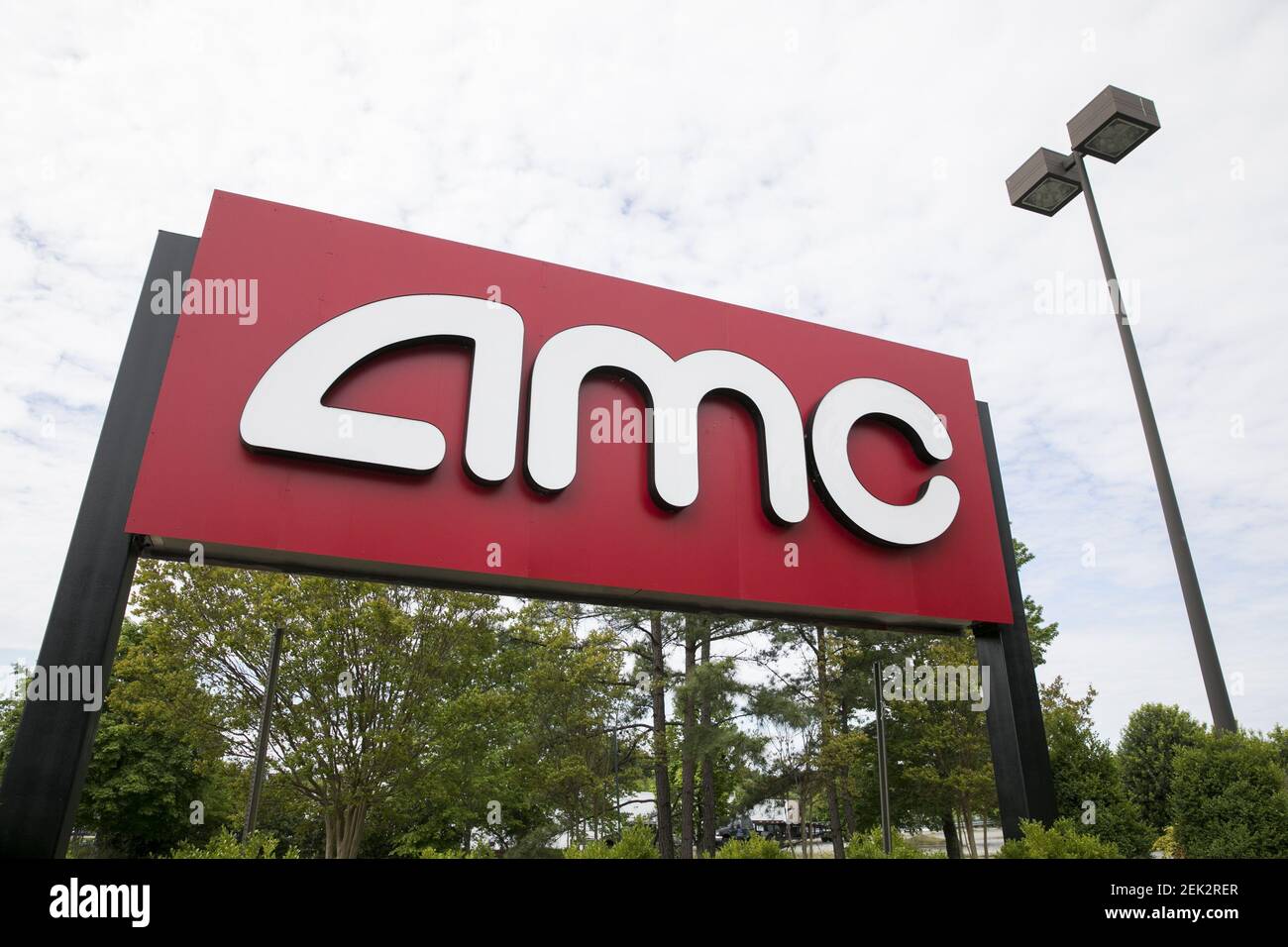 A logo sign outside of a AMC Theatres movie theater location in