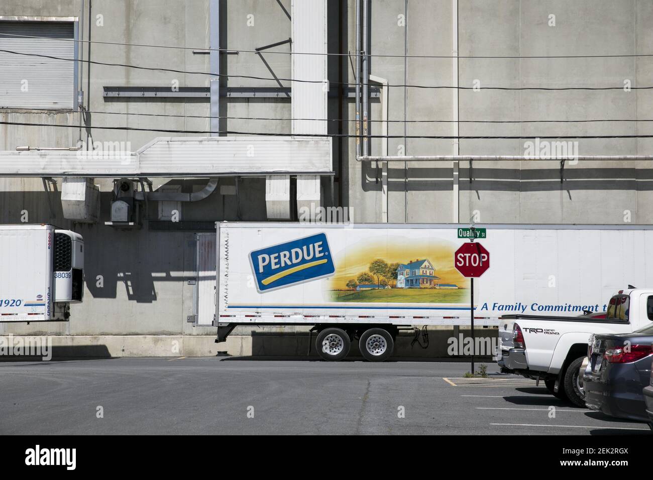 A logo sign outside of a Perdue Farms poultry processing plant in