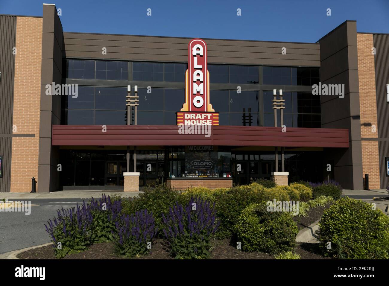A logo sign outside of a The Alamo Drafthouse Cinema movie theater