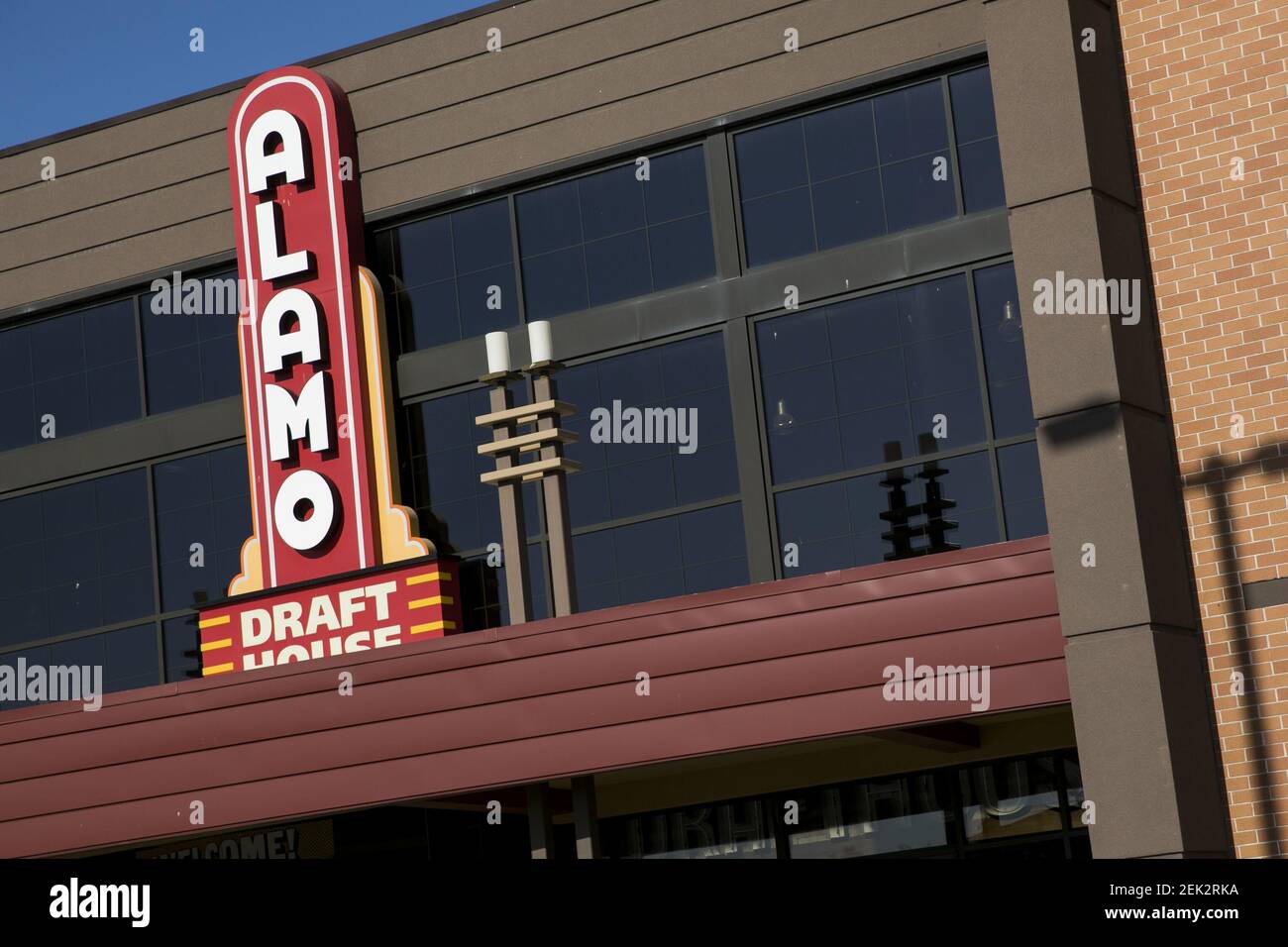 A logo sign outside of a The Alamo Drafthouse Cinema movie theater