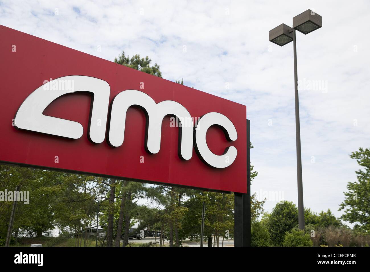 A logo sign outside of a AMC Theatres movie theater location in