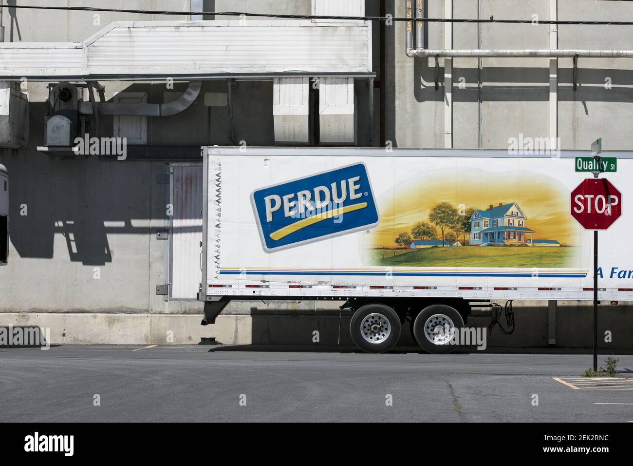 A logo sign outside of a Perdue Farms poultry processing plant in