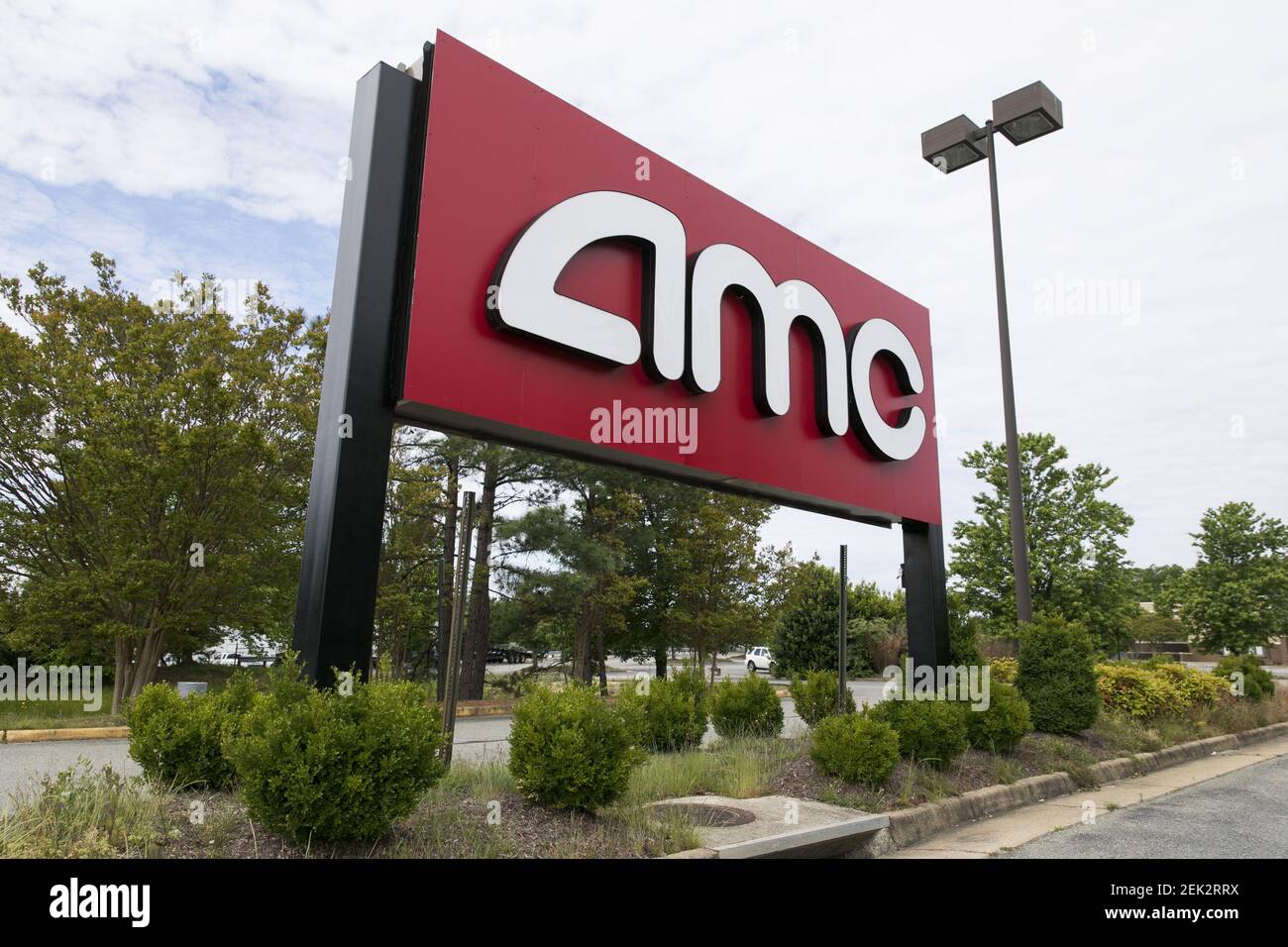 A logo sign outside of a AMC Theatres movie theater location in