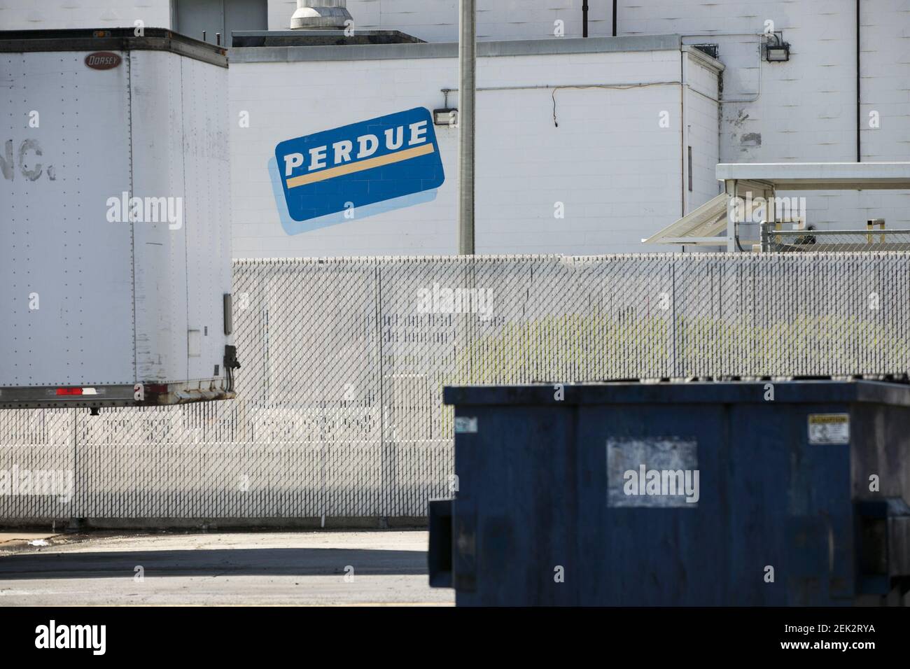 A logo sign outside of a Perdue Farms poultry processing plant in