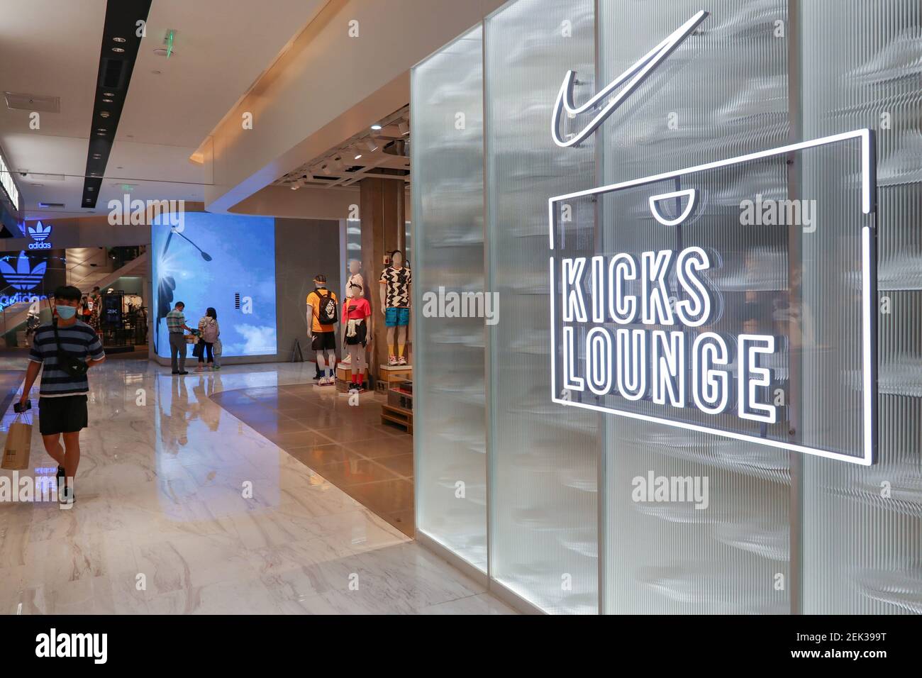 People walk past the Nike Kicks Lounge L1 2.0 experience store in Hangzhou  city, east China's Zhejiang province, 20 May 2020. (Photo by Zhan  Yu/ChinaImages/Sipa USA Stock Photo - Alamy