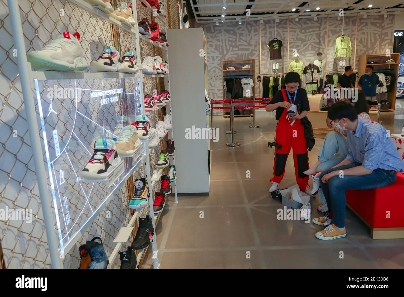 People shop at the Nike Kicks Lounge L1 2.0 experience store in Hangzhou city, east China's Zhejiang province, 20 May 2020. (Photo by Zhan Yu/ChinaImages/Sipa USA Photo - Alamy