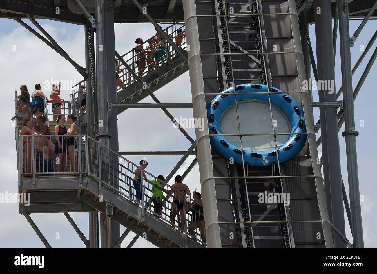 People wait in a queue to ride the raft ride at Island H2O Live! water ...