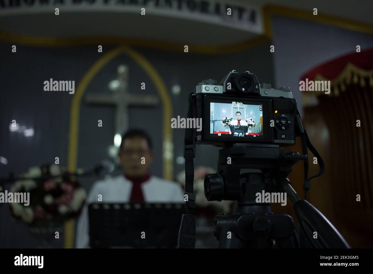 Pastor Weslin B Dalimunte take part during the virtual Sunday worship at  the Protestant Batak Christian Church of the Nommensen (HKBP) Petojo  Resort, West Jakarta, Indonesia, amid social distancing restriction?s of  Covid-19